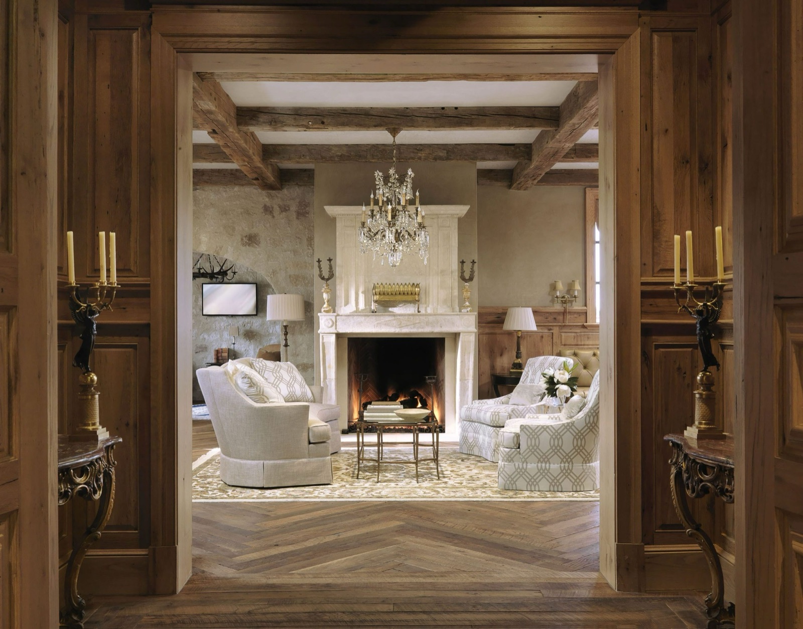 Formal room with reclaimed paneled doors and herringbone floor